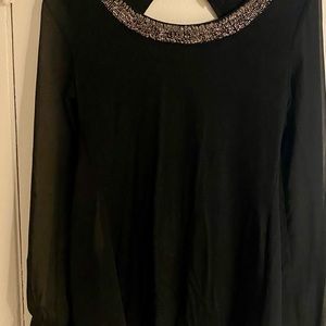 From Express. vintage! beautiful backless blouse. been kept in perfect shape!!!